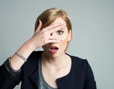 Woman covering her eyes