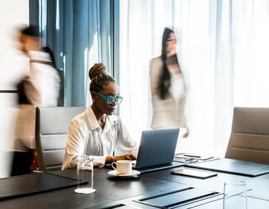 Woman sitting at desk using a laptop