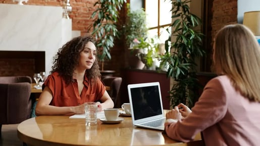 Two people in an annual performance review meeting